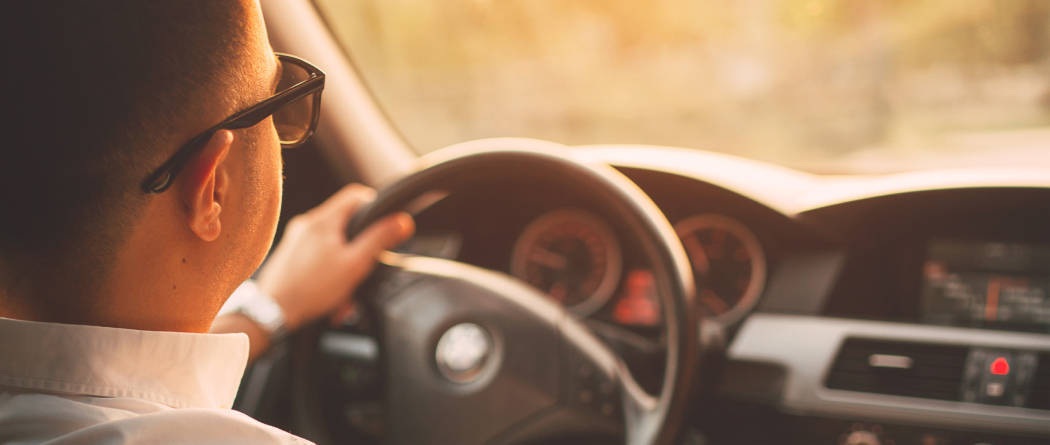 man driving car